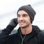 Man in headphones listening to lessons