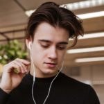 Man in headphones listening to lessons