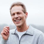 Man in headphones listening to lessons