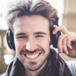 Man in headphones listening to lessons